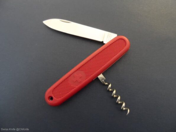 a red pocket knife with a corkscrew